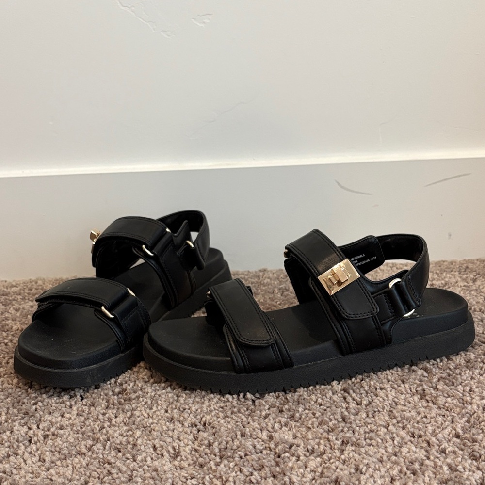Black velcro adjustable sandals. Size 8 only worn once.